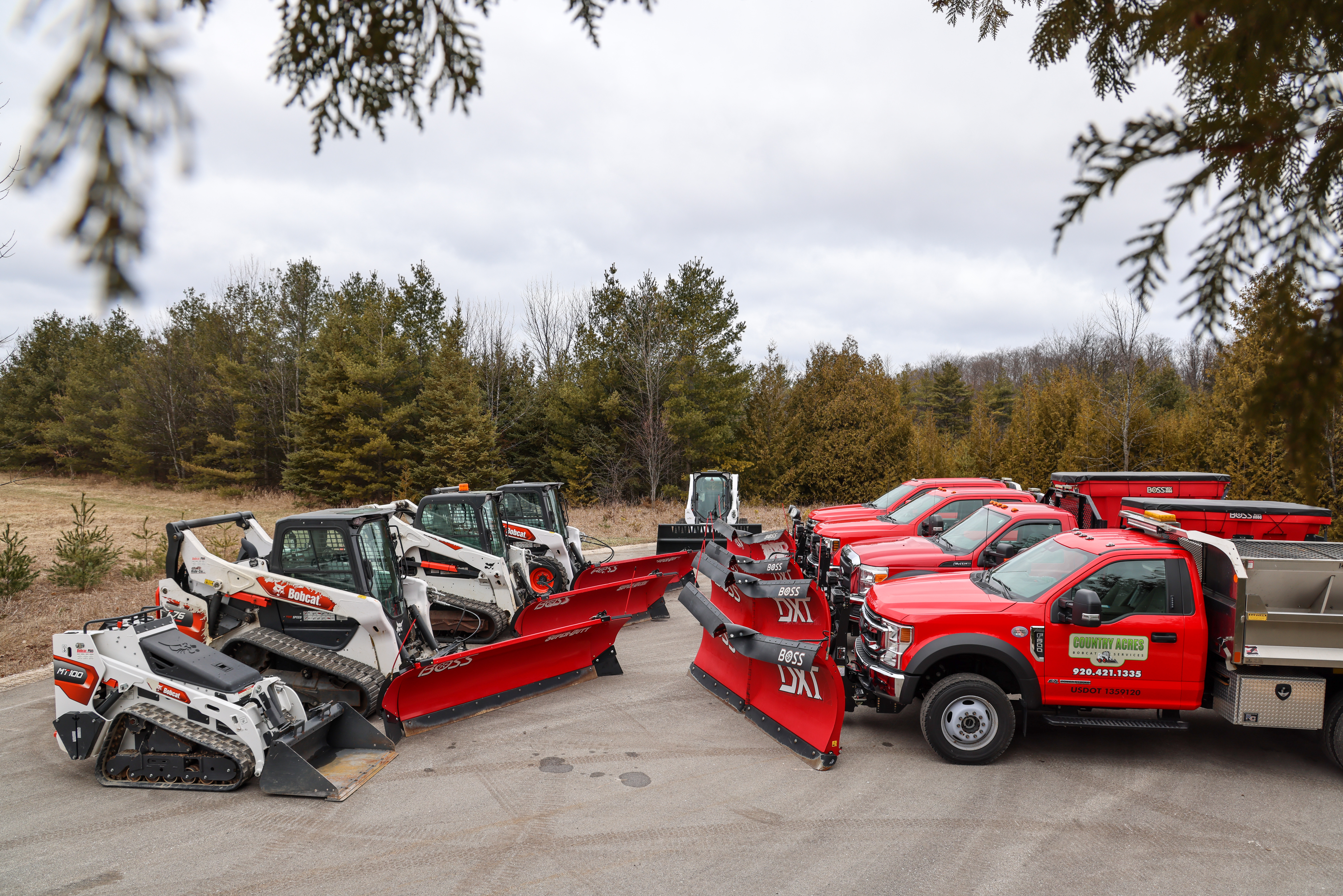 Fleet of trucks and bobcats